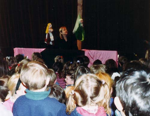 Claire entertaining children with puppets in Cinderella